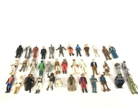 A large collection of vintage Star Wars figures including r2d2 and storm trooper etc