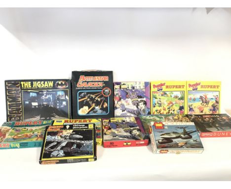 Collection of various vintage jigsaw puzzles including bat man and Dune etc.