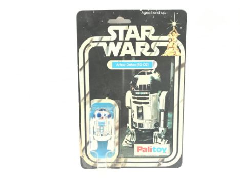 A Vintage Star Wars Palitoy 1977 Carded R2-D2. One of the first 12 Figures released. Damage to. Are And Blister.