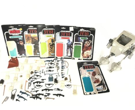 A Vintage Star Wars Scout Walker (Parts Missing) a Collection of Vintage Weapons and 6 Backing Cards.