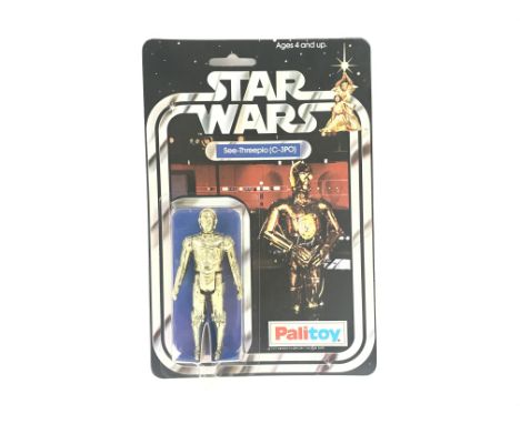 A Vintage Star Wars Palitoy 1977 Carded C3PO. One of the first 12 Figures released.