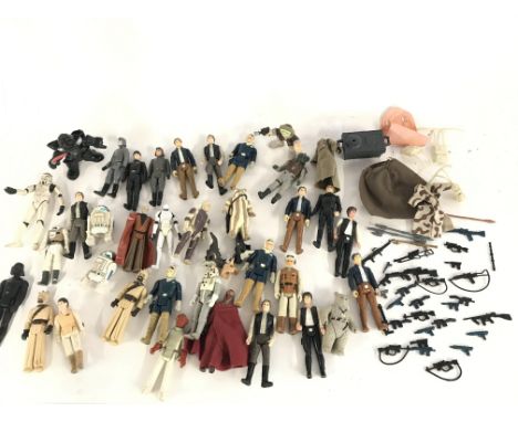 A Collection of Vintage Star Wars Figures and Guns.
