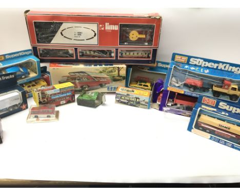 A Box Containing a Collection of Various boxed Die-cast including Matchbox Super Kings. A Lima Train Set. Etc.