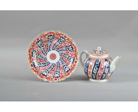 with a shaped rim, 19.5cm diameter and marked to the underside, together with a canon ball teapot and cover, the cover with a