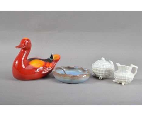 comprising a Poole pottery bird, 14cm H x 17cm W, a Prinknash pottery dish, with carrying handle and scalloped rim with a blu