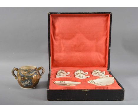 the box with faux crocodile skin cover, six cups and saucers, with floral design and with character marks to the undersides, 