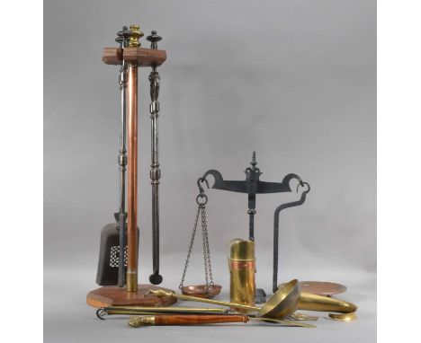 comprising a fireside companion set, the stand wooden and copper, the three companions in black cast metal, the stand 80cm hi