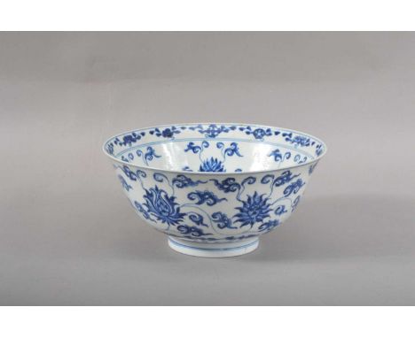 with blue floral design on a white ground, with a Kangxi style six character mark to the underside, within a double blue ring