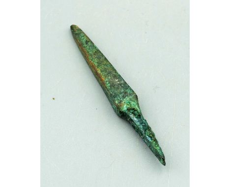 A rare Classical Greek bronze arrowhead, ca. 480 - 330 BC. This bodkin point is 2-5/8 in. long, has a head with nearly straig