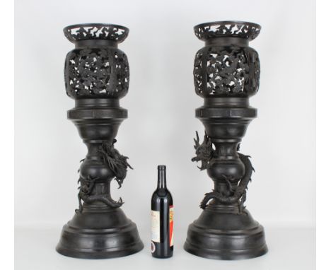 Signed Pair of Bronze Chinese Lanterns. Each with dragons surrounding the lower portion of the Lantern. Reticulated upper por