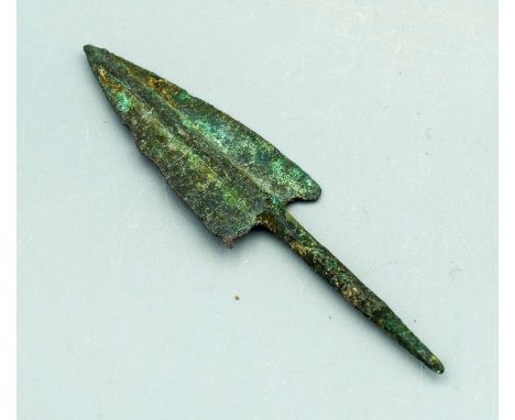 A choice bronze arrowhead, Elamite Middle Period. 1200-800 BC. This excellent deltoid example is 3-1/2 in. long, has long, th