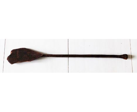 A beautifully carved ceremonial paddle from the Austral Islands, ca. early 1800's. This lavishly decorated paddle is 44" long