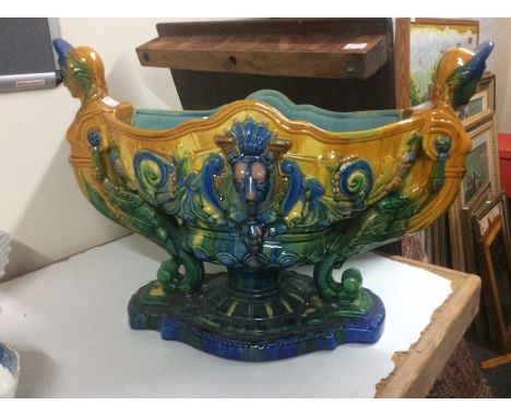 A Majorlica style two handled planter, the handles in the form of grotesque Classical figures with acanthus bodies and scroll