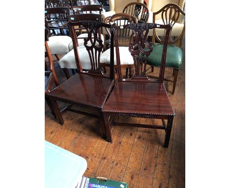 A pair of Chippendale style mahogany hall chairs, fitted with solid seats (2)