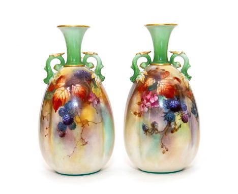 A pair of Royal Worcester twin handled vases painted with leaves and berries. Signed K. Blake. Circa 1905. Green mark H153 - 