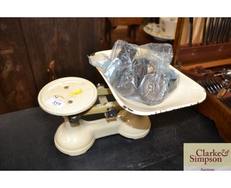 A set of vintage cast iron and enamel kitchen scales and various weights 