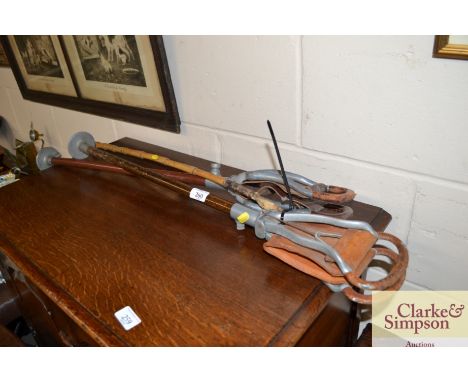 Two vintage shooting sticks and a riding crop