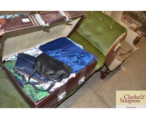 A vintage suitcase and contents of various clothing, textiles, handbags etc.