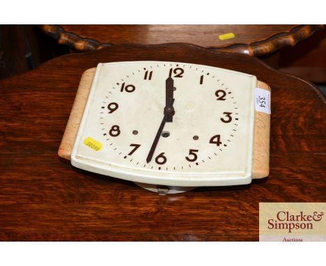 A retro Bakelite type cased wall clock 