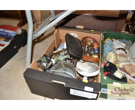 A box of miscellaneous sundry items including shells, egg ornaments, fishing reel etc. 