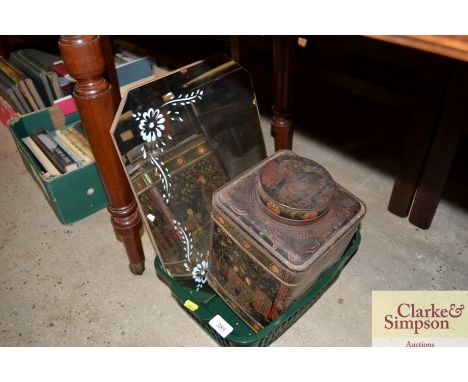 A vintage tea tin and a mirror