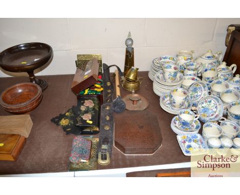 A wooden trinket box; papier maché wall mounting letter rack; a leather strap with brass decoration; a cased manicure set; an