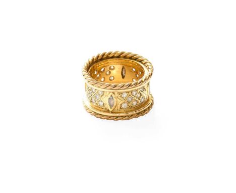 An 18 Carat Gold Diamond Ring, the broad shank set throughout with round brilliant cut and marquise cut diamonds, in yellow c