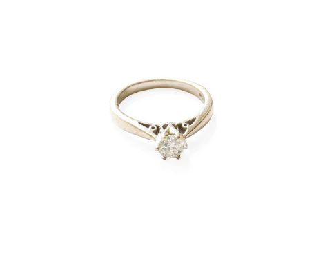 A Platinium Diamond Solitaire Ring, the round brilliant cut diamond in a claw setting, to a tapered shoulder plain polished s