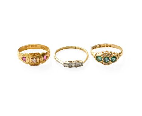 An 18 Carat Gold Ruby and Diamond Three Stone Ring, finger size M1/2; A Diamond Three Stone Ring, stamped '18CT' and 'PLAT', 