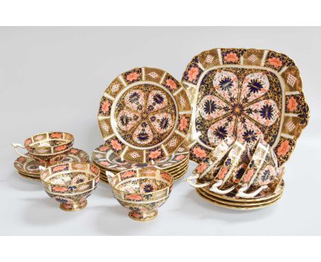 A Royal Crown Derby Porcelain Six Place Tea Service, decorated in the Imari style comprising: six cups, saucers and side plat