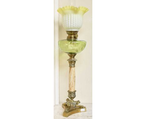 A Victorian Oil Lamp, with satin vaseline glass shade, green glass reservoir, brass and marble pedestal terminating on a trif