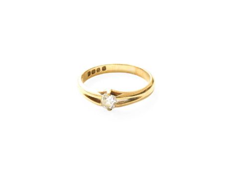 An 18 Carat Gold Diamond Solitaire Ring, the old cut diamond in a yellow claw setting, to a plain polished shank, estimated d