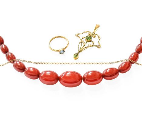 An Amber Bead Necklace (a.f.); An Edwardian Green Glass and Split Pearl Pendant, with applied plaque stamped '9CT', measures 