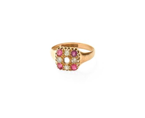 An 18 Carat Gold Ruby and Diamond Cluster Ring, the rectangular plaque set throughout with old cut diamonds and cushion cut r
