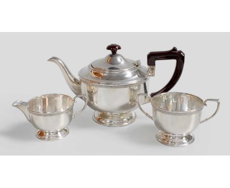 A Three-Piece George V Silver Tea-Service, by Roberts and Dore Ltd., Birmingham, 1920 and 1921, each piece tapering and on sp