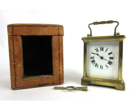 A French brass cased five glass carriage clock, the enameled face with Roman numerals, in original case, h. 14 cm, w. 8 cm, d