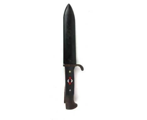 A WWII German Hitler Youth dagger marked Puma Solingen to blade with Blut und Ehre slightly visible, with black checkered gri