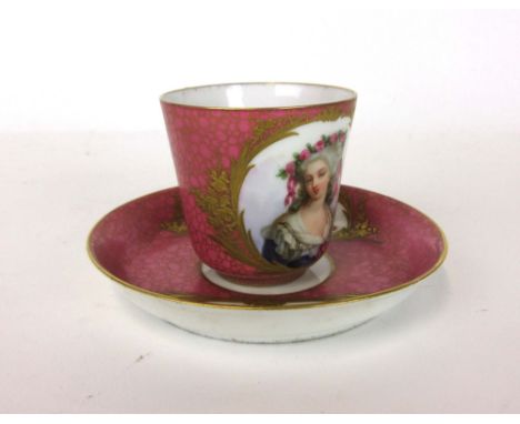 A late 18th century French cabinet cup and saucer, the pink and gilt craquelure ground hand painted with a depiction of Marie