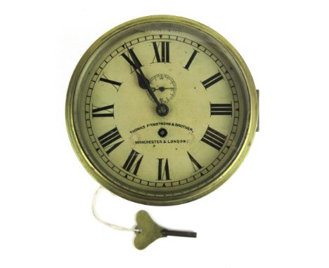 A late 19th/ early 20th century brass cased ships timepiece, the enameled face with Roman numerals and second dial, signed 'T