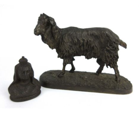 A brown patinated unmarked bronze figure modeled as a sheep (missing its horns) together with an early 20th century cast iron