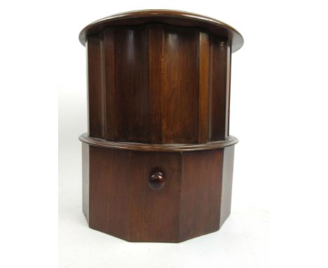 A Victorian circular step commode with tooled leather insert to top over fluted sides and pull out step, h. 45 cm, dia. 43 cm