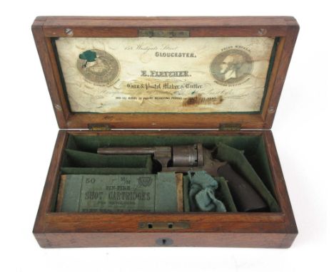 A boxed 19th century 50mm pinfire revolver made by E. Fletcher of Gloucester, with a floral scroll lock, folding trigger, eje