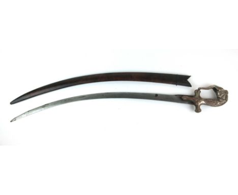 A 19th century Indian Tulwar sword having a curved single edged blade, having a plated elephant decorated hilt with the head 