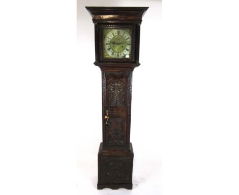 A 19th century carved oak longcase clock, the brass and silvered face with Roman and Arabic numerals, pierced hands and spand