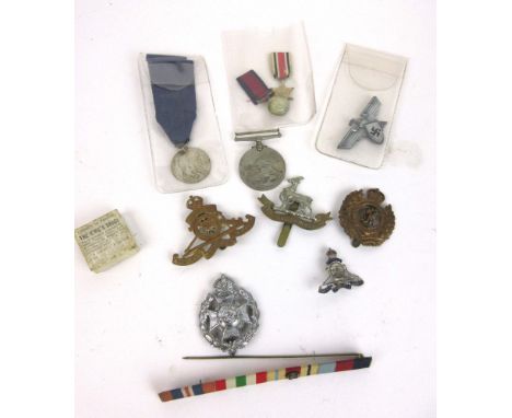 A 1939 WWII campaign medal together with a miniature 1939-1945 Star, miniature Victorian medal, A German Army 4 Year service 