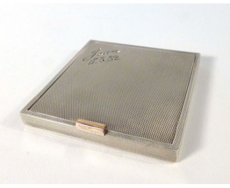 A silver and engine turned compact of square form, DS & S, London 1946, w. 6.5 cm   CONDITION REPORT:  With personalised engr