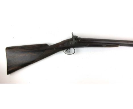 A Thomas Belliss 8 bore double Damascus barrel percussion shotgun, with checkered grip rosewood stock engraved hammers and lo