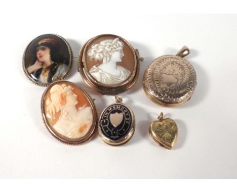 A yellow metal mourning locket of oval form, decorated in black enamel and reading 'in memory of' and having Masonic engravin