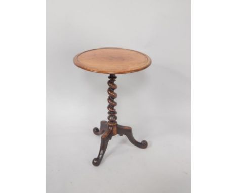 A 19thC circular tripod table, with barleytwist stem, 69cm high.