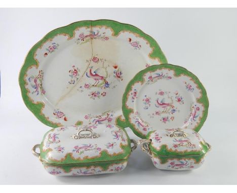 A Bishop and Stonier late 19thC pottery part dinner service, decorated in the Pheasant pattern against a green scale ground, 